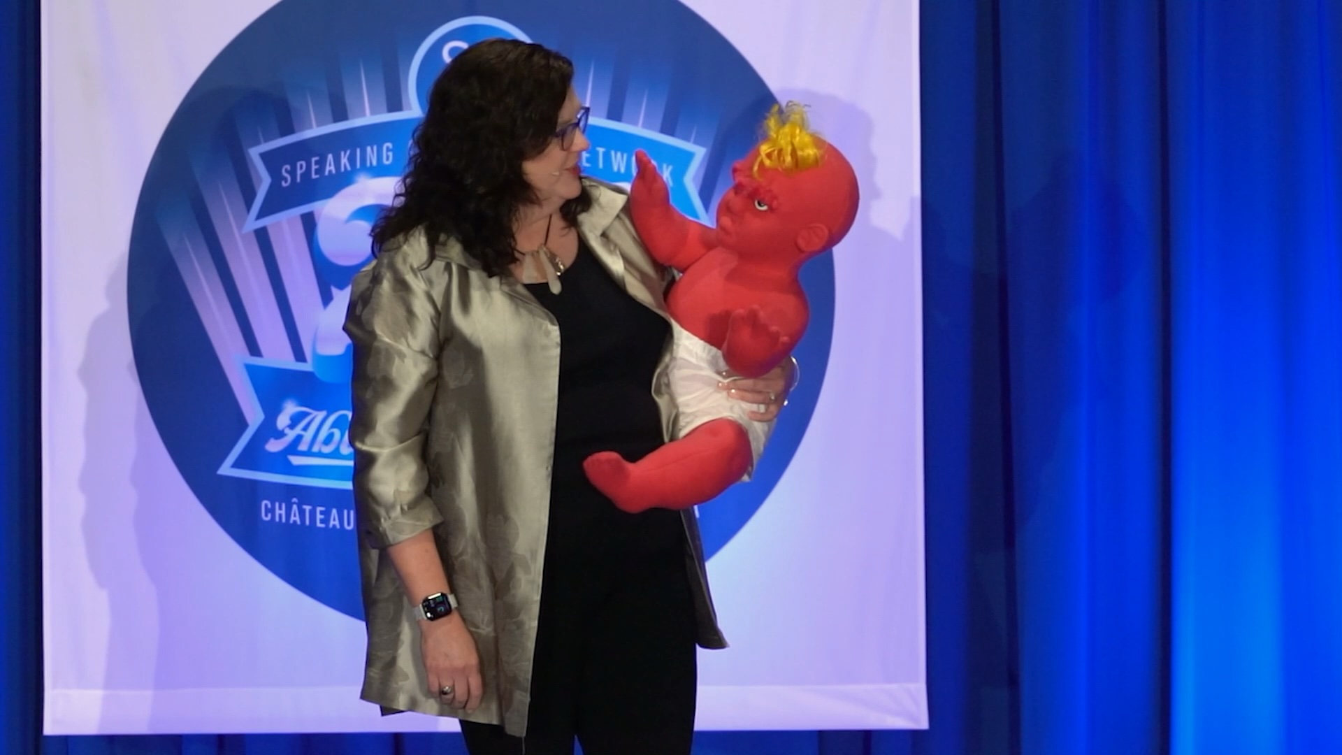 Penny Reed on stage with the Bitter Baby® prop